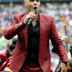 English-Singer-Robbie-Williams-Red-Prom-Suit